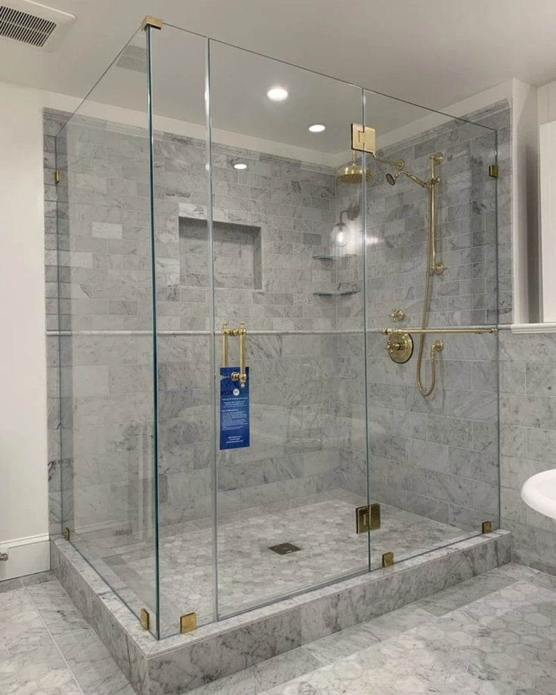 Premium Custom luxury frameless glass shower enclosures, leak-proof shower cabins, and premium hinged bathroom glass doors fabricated and installed by Al Najm Glass and Mirror. Featuring heavy-duty rust-resistant matte black hardware for high-end residential villas and luxury apartments in Doha, Al Rayyan, Lusail, and The Pearl Island, Qatar.